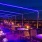 a group of tables and chairs with lights on them