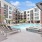a pool with poolside seating