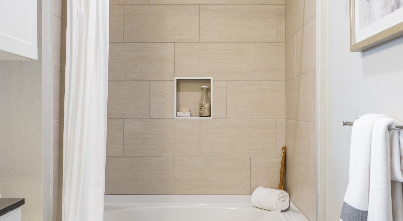 Bathroom options with thoughtful details a bathroom with a bathtub and toilet