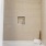 a bathroom with a bathtub and toilet