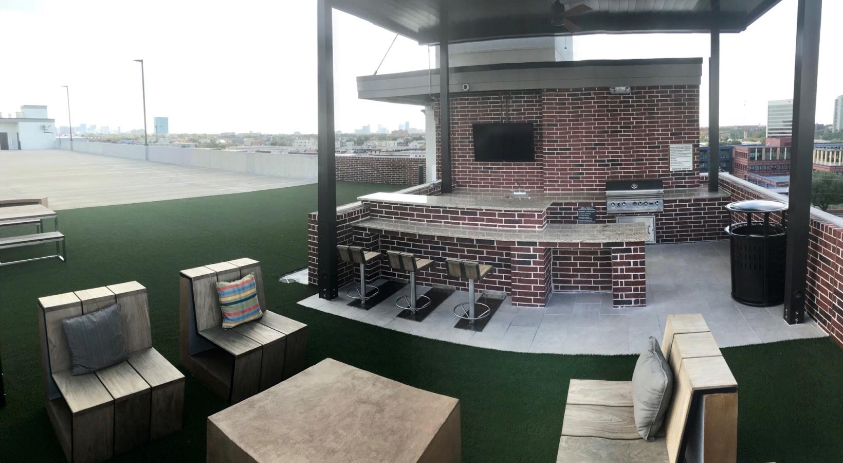 Enjoy our resident-only features a room with a brick wall and a brick fireplace