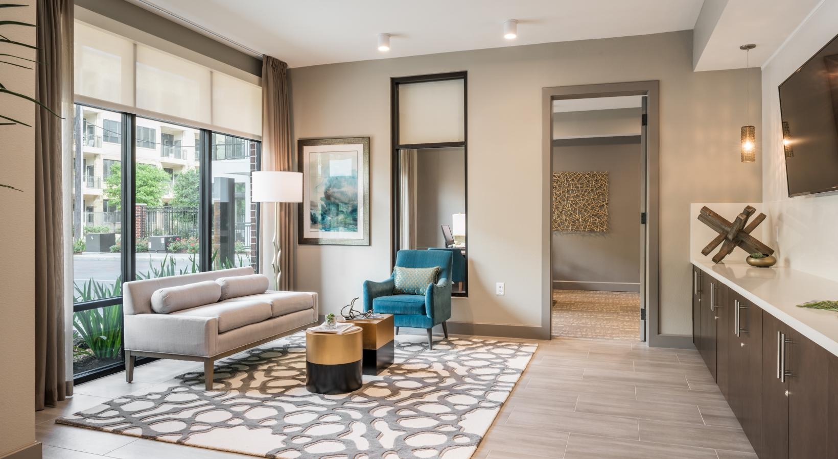 Settle into comfort at Tinsley on the Park a living room with a glass door