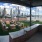 a patio with chairs and a view of a city
