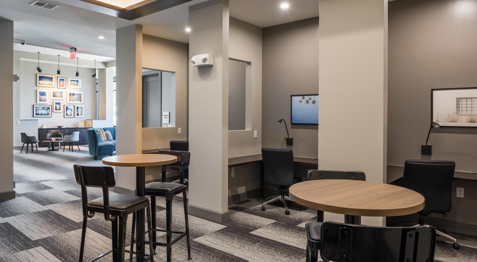 Enjoy our resident-only features a room with tables and chairs