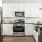 a kitchen with white cabinets