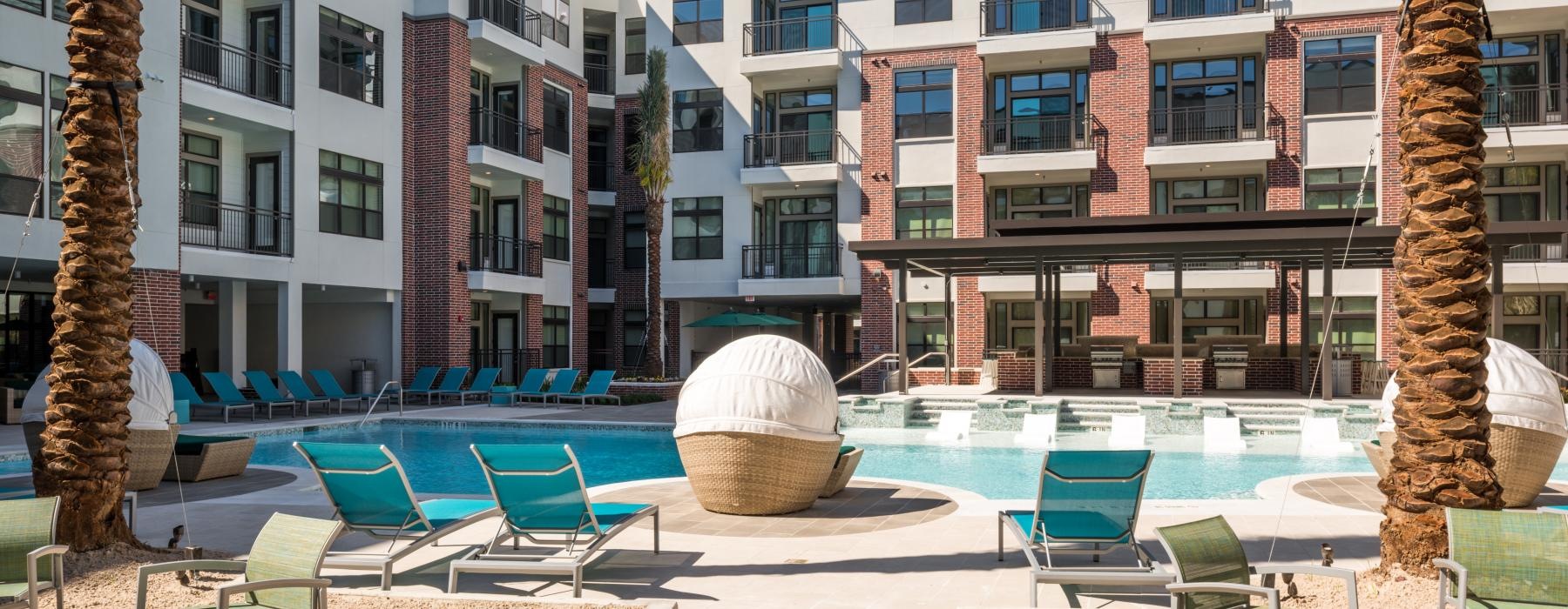a pool with chairs around it