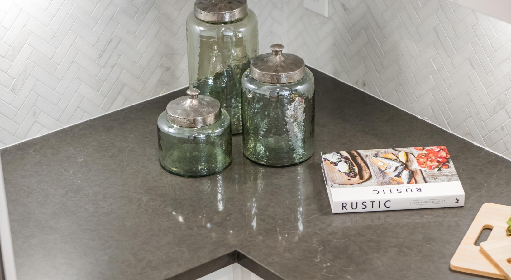 Spacious kitchens with thoughtful details a counter top with glass jars on it