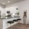 a kitchen with stools and a bar stool