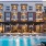a swimming pool in front of a building