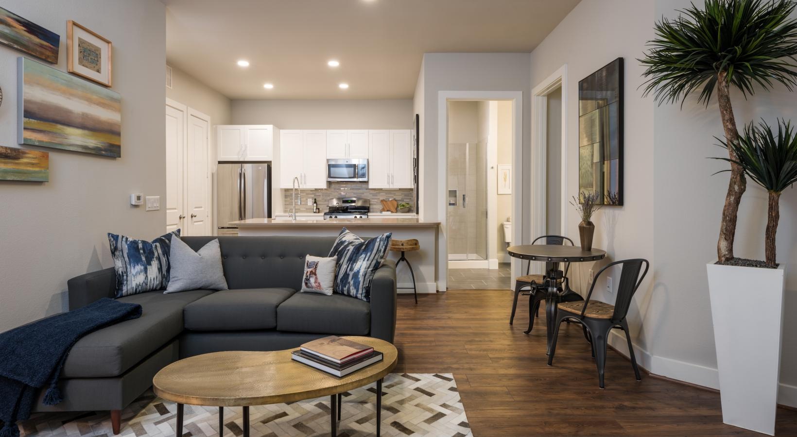 Relax and unwind in stylish living spaces a living room with a couch and a table