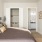a bedroom with a bed and a desk