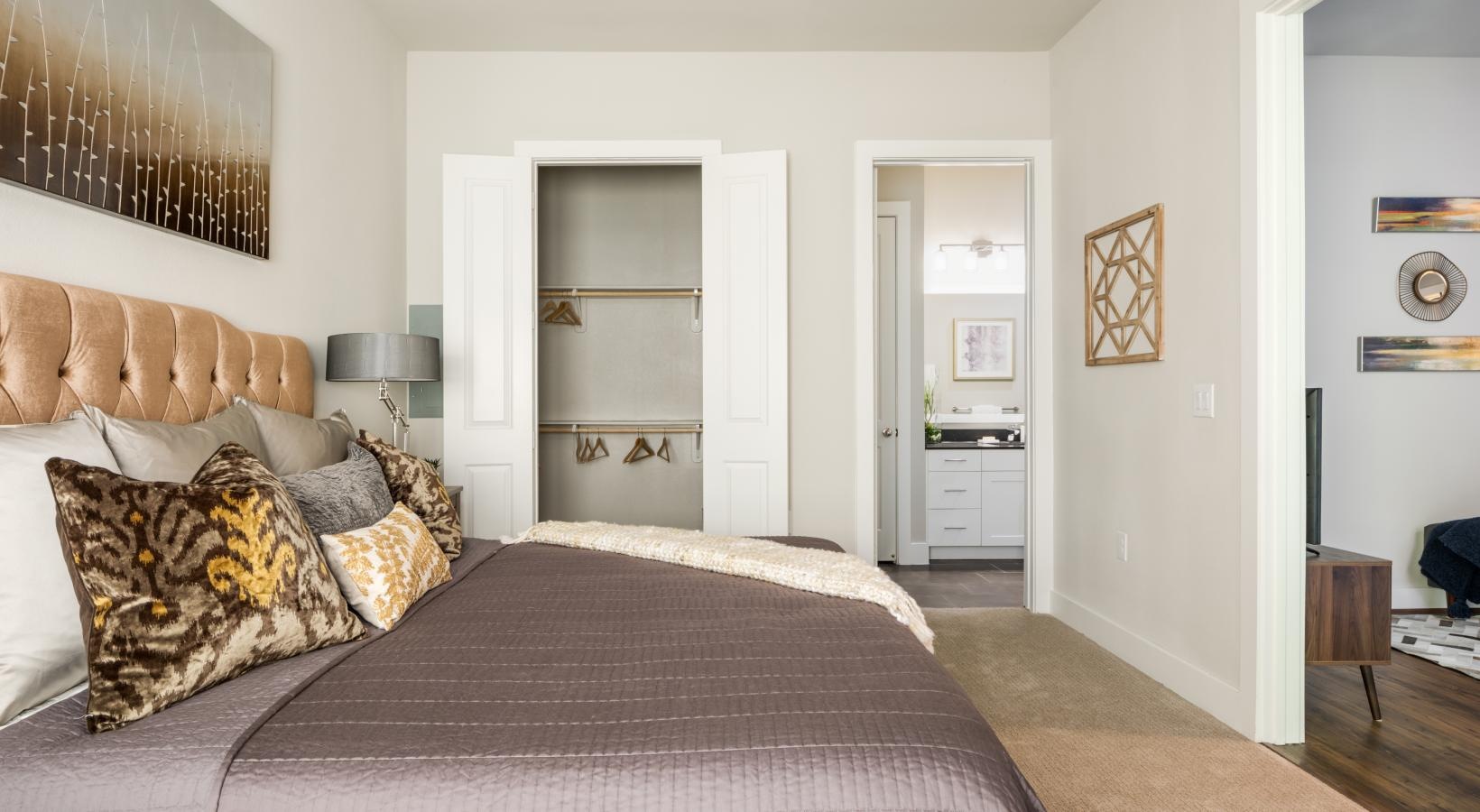 Relax and recharge in beautiful and spacious bedrooms a bedroom with a bed and a desk