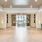 a large room with a wood floor and a large glass door