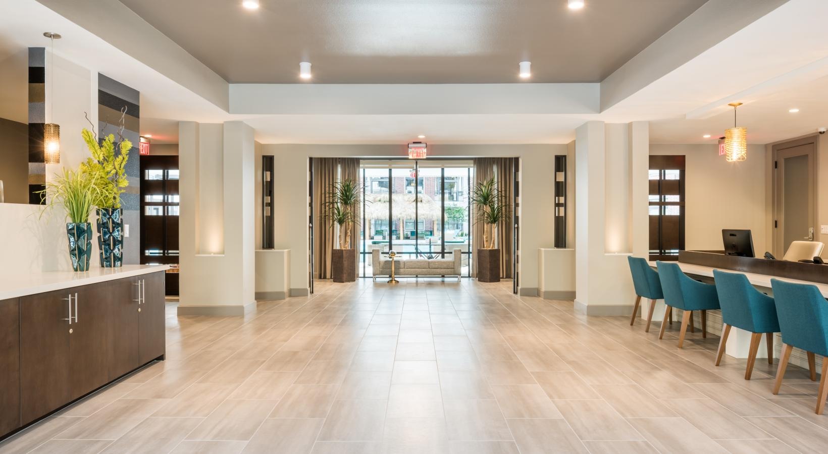 Access to resident-only features a large room with a wood floor and a large glass door
