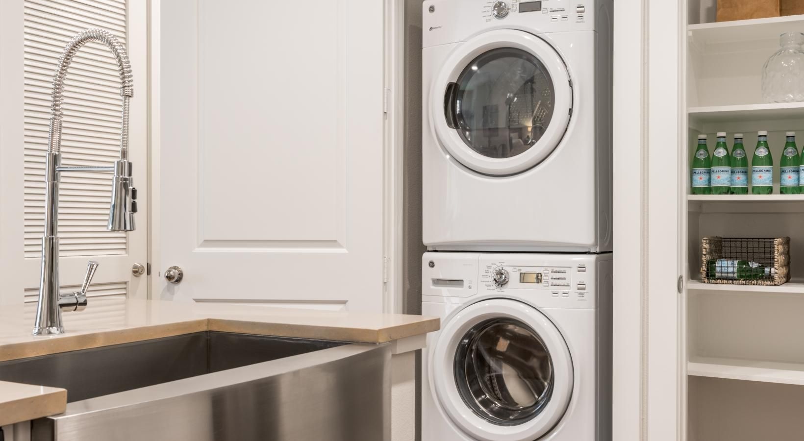 Beautiful kitchens with designer finishes a washer and dryer in a kitchen
